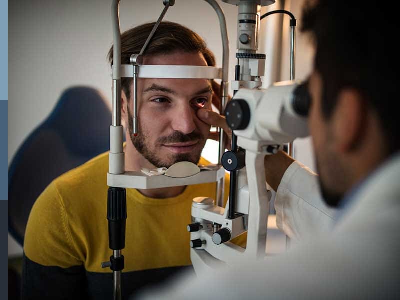 A doctor observing a person's eyes