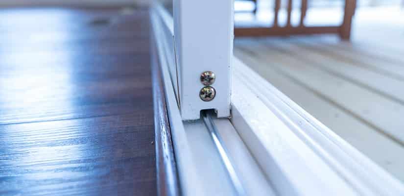 A foot view of sliding glass dooor rollers