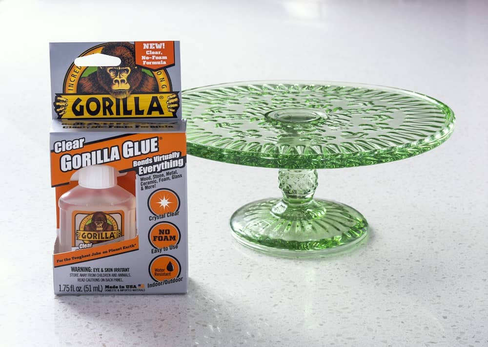 Gorilla glue placed alongside a green glass plate