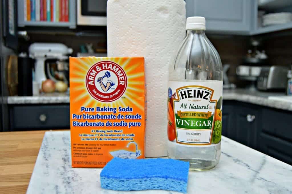 Vinegar and baking soda on a kitchen counter