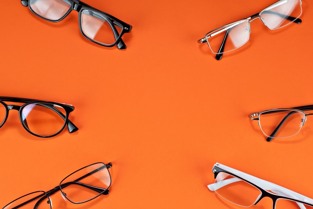 Different Types Of Glasses On An Orange Background Close Up