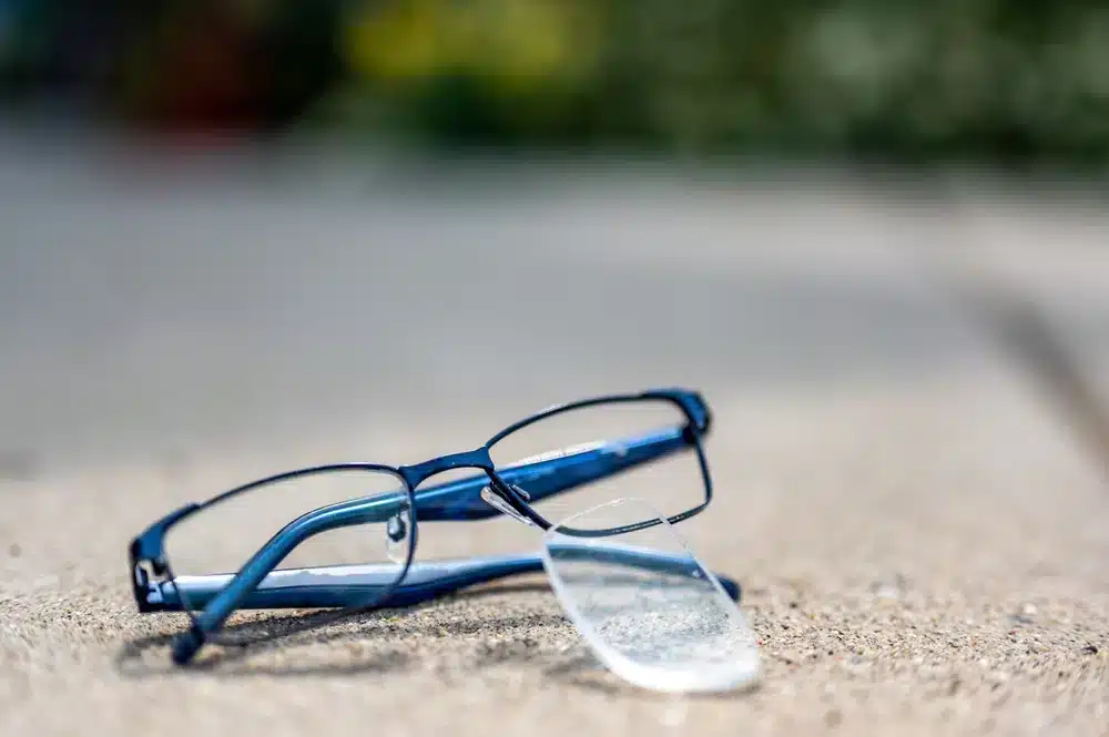 Selective focus on damaged glasses with scratched lens popped out