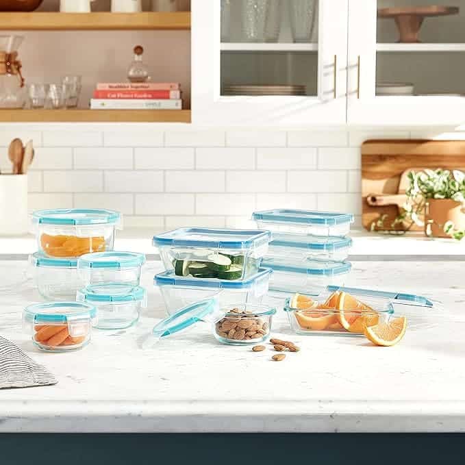 Snapware Total Solution Glass Food Storage Set placed on a kitchen shelf with stored food items