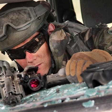 a military man wearing ESS Crossbow Suppressor X