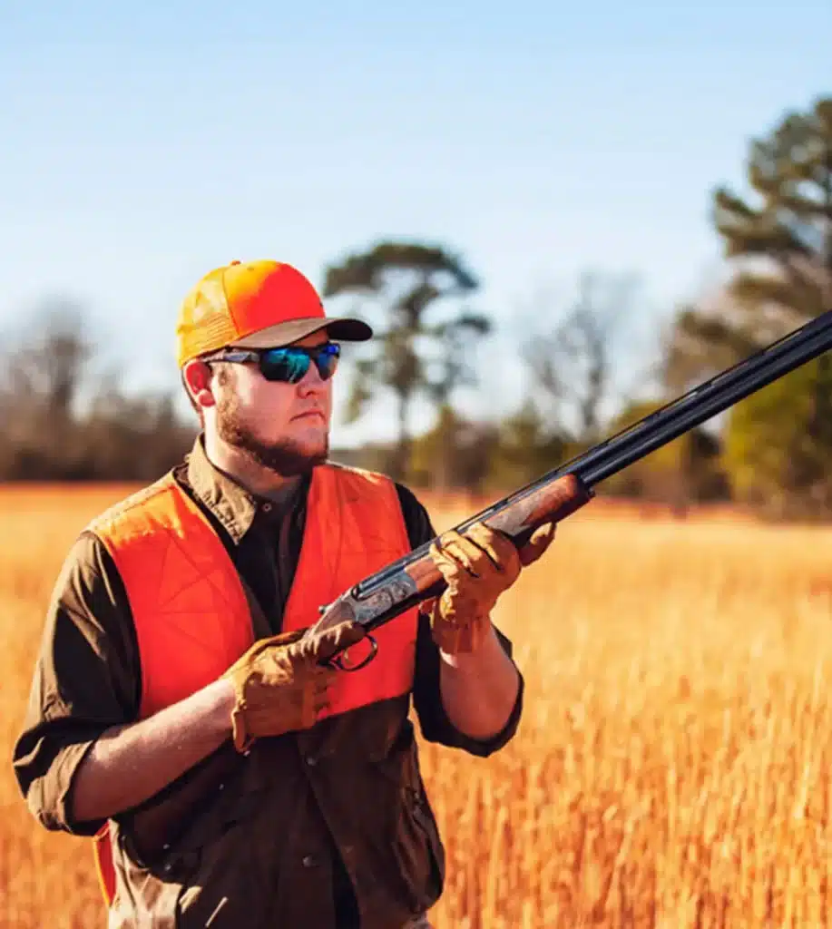 a shooter carrying a gun and wearing Randolph Engineering Ranger Falcon