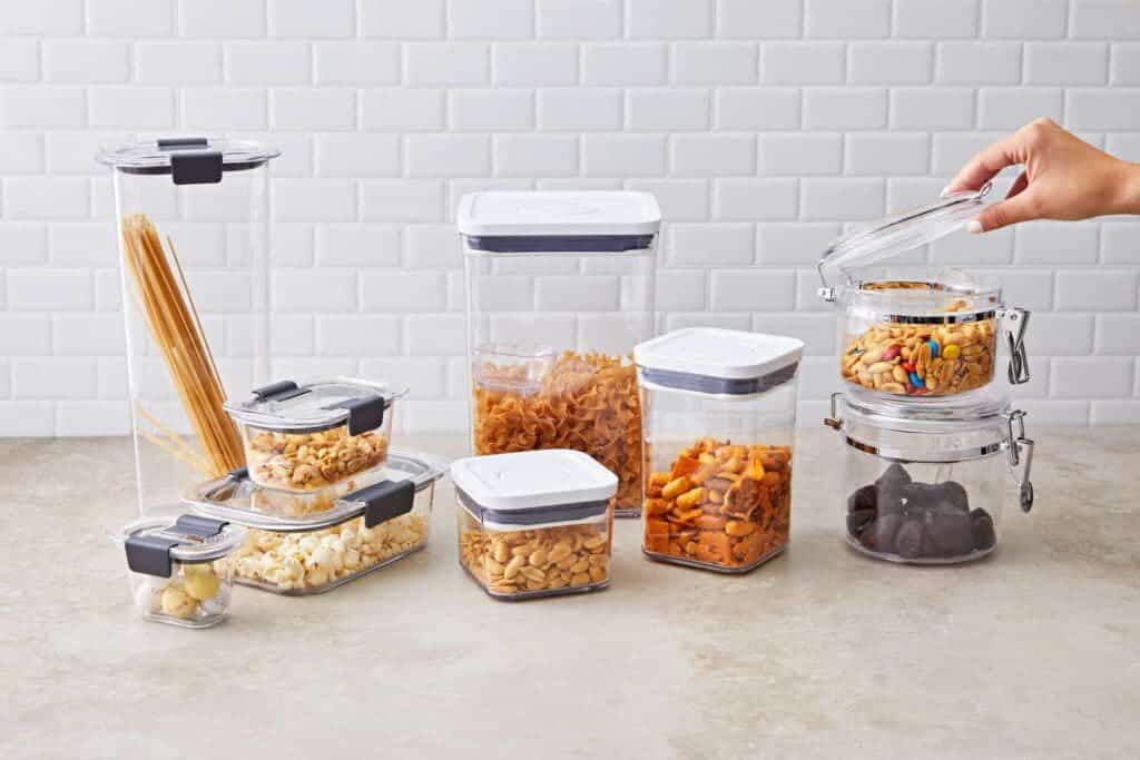 a variety of food storage containers with different food items stored in them