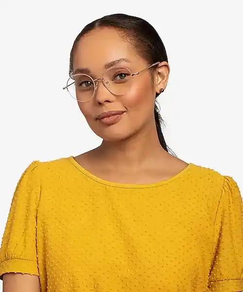 a woman with square face wearing oval shaped glasses