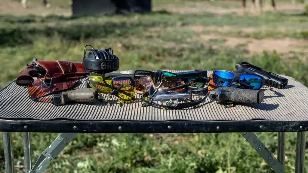 different types of shooting glasses placed on a bench