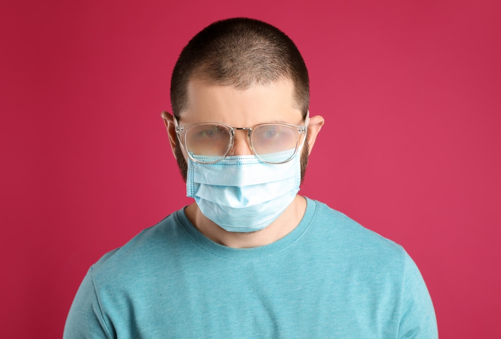 Man With Foggy Glasses Caused By Wearing Disposable Mask On