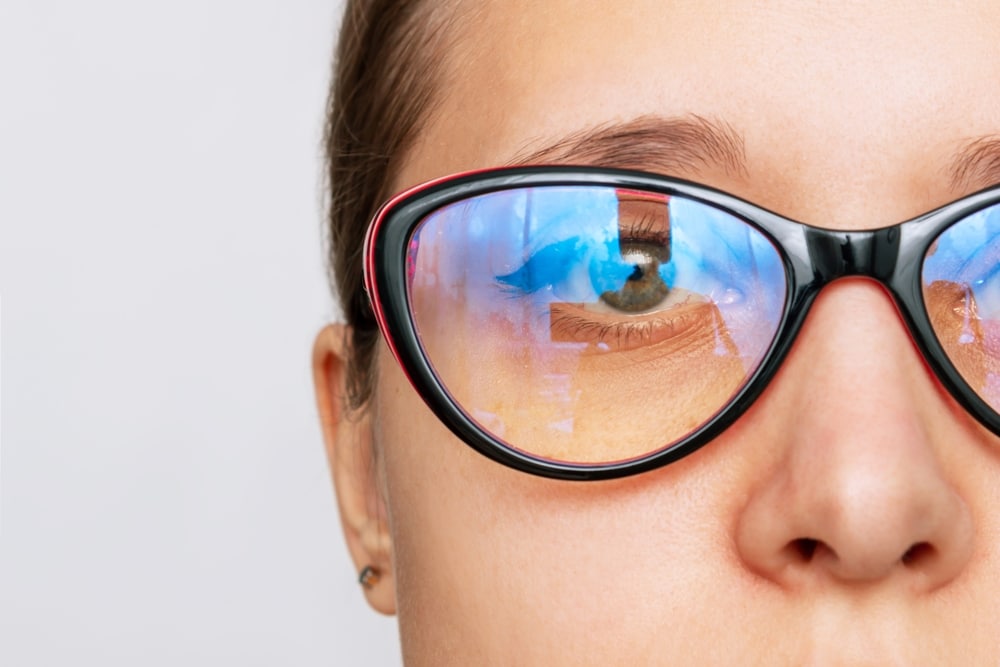 Cropped Shot Of Woman's Face With Red And Black glasses