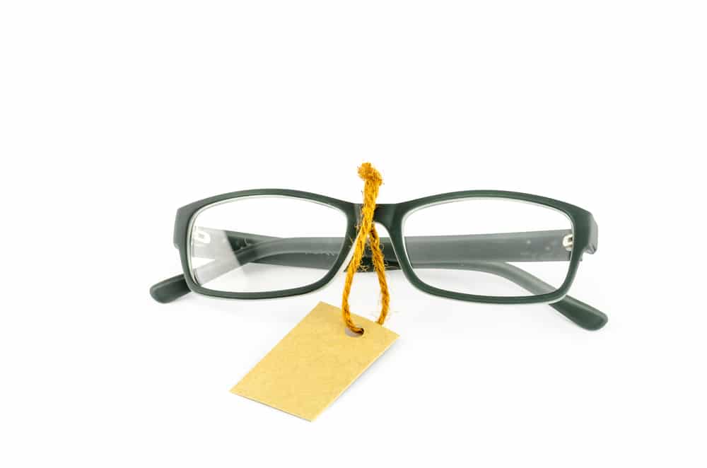 Glasses And Cost Tag On A White Background