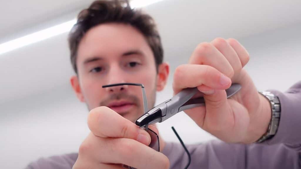 A view of a guy fixing a glass nose pads A view of a guy fixing a glass nose pads